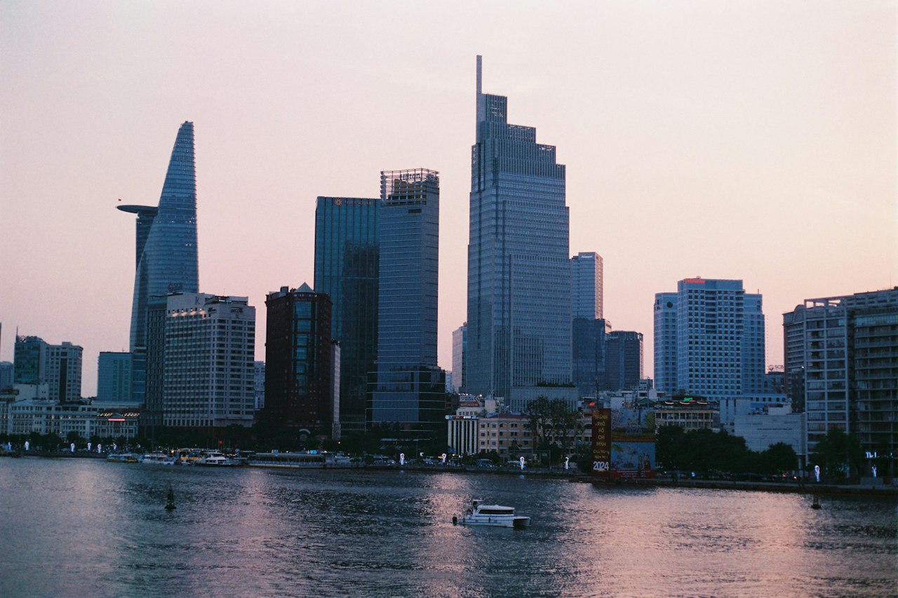 The Ho Chi Minh City skyline with Bitexco Tower across the Saigon River at dusk