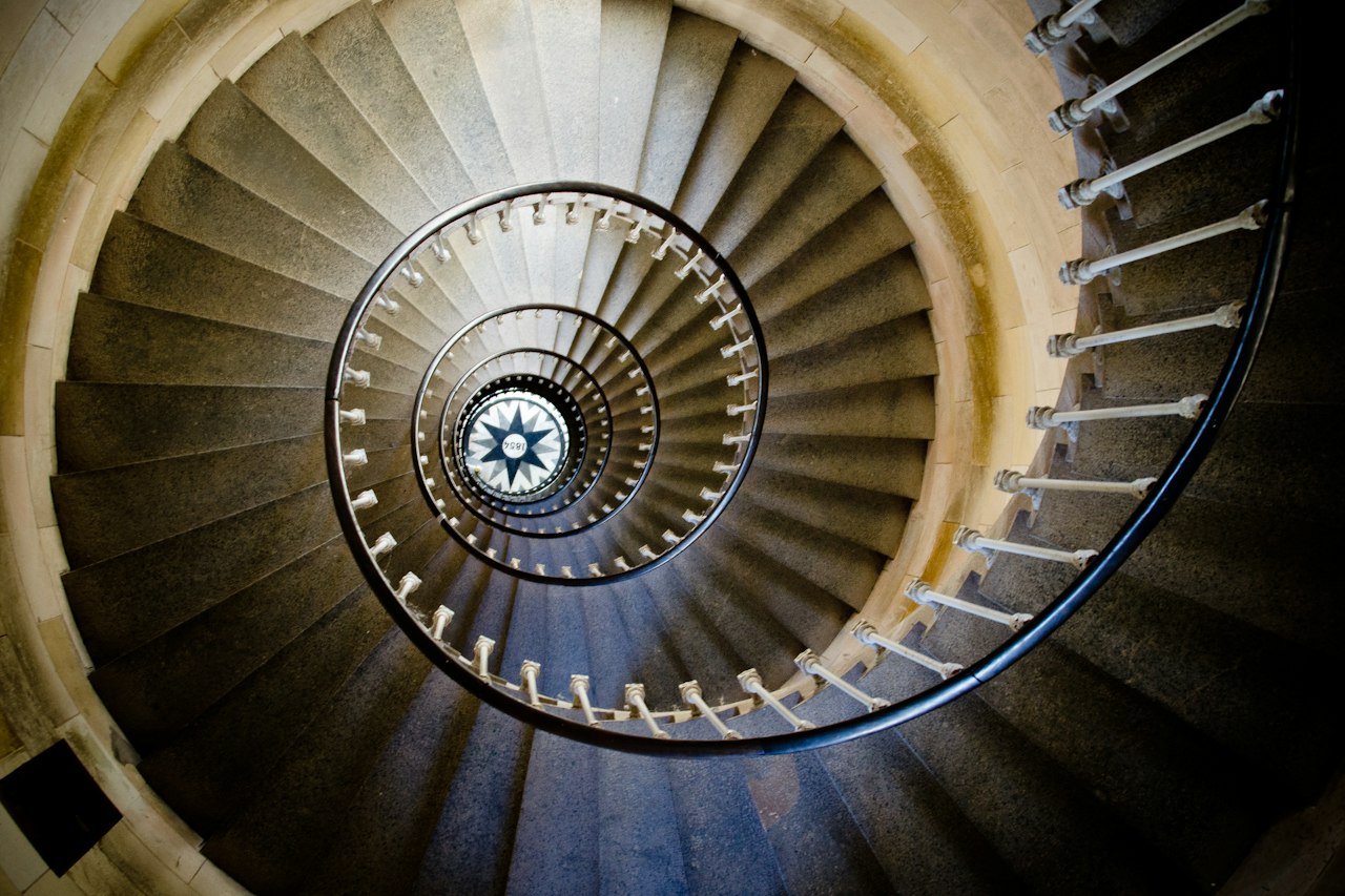 The spiral staircase of a lighthouse, seen from below