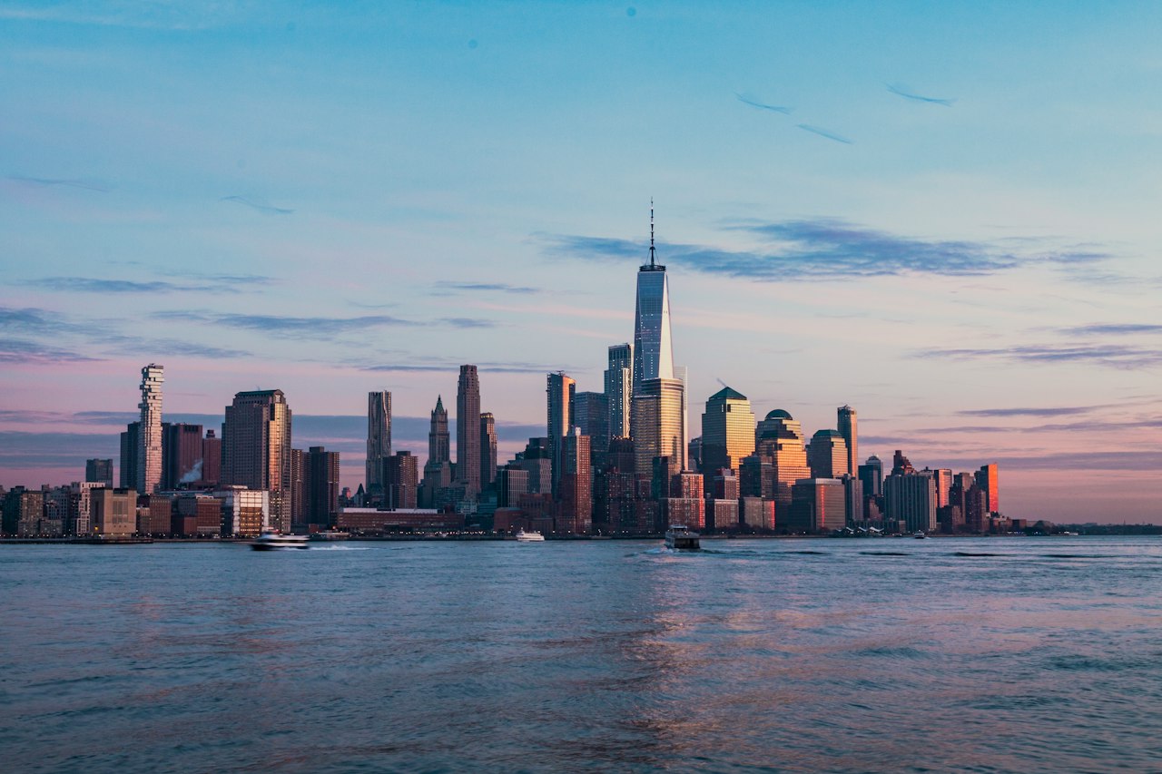 The Lower Manhattan skyline across the Hudson River from Hoboken at dusk