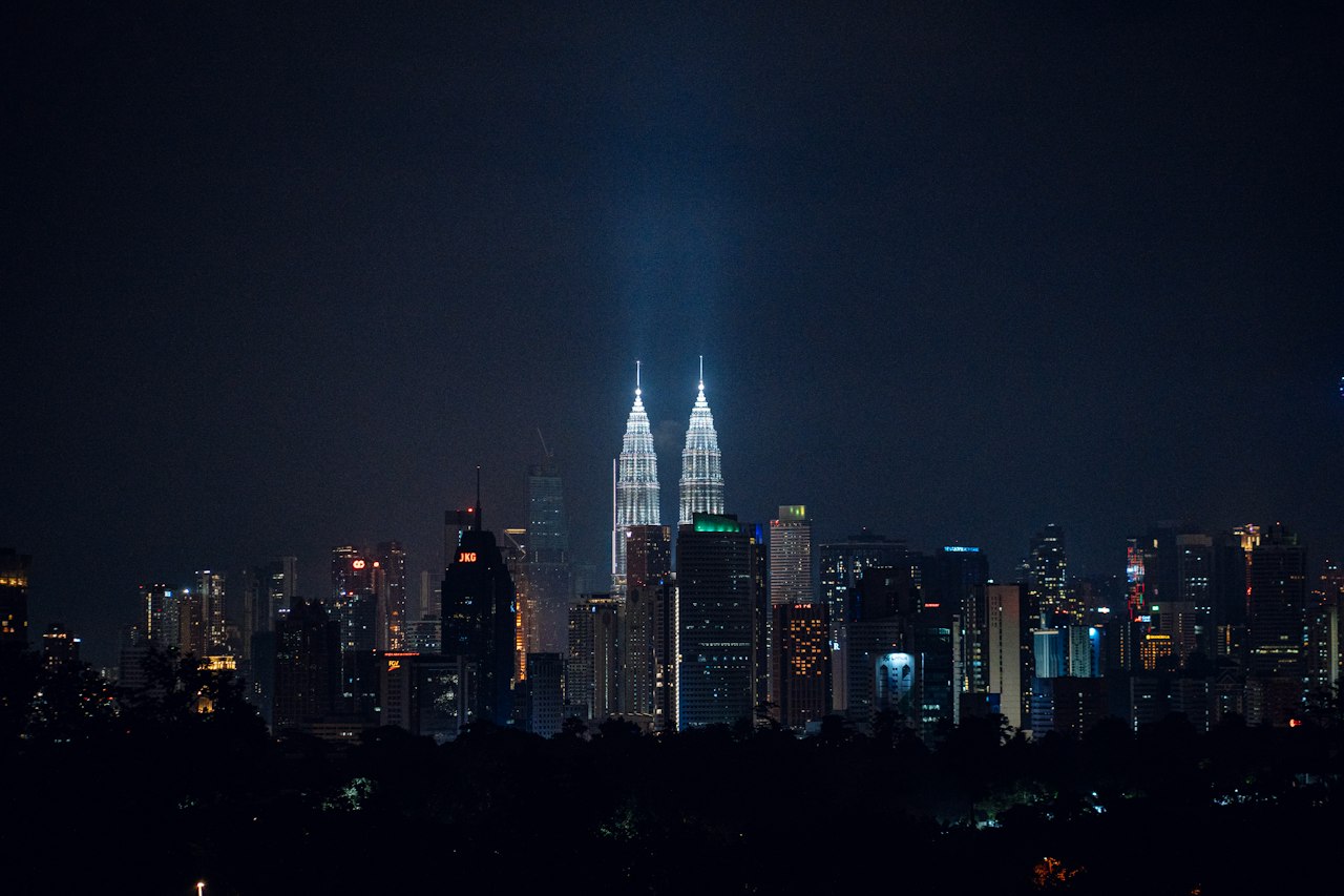 The Petronas Towers and the Kuala Lumpur skyline at night