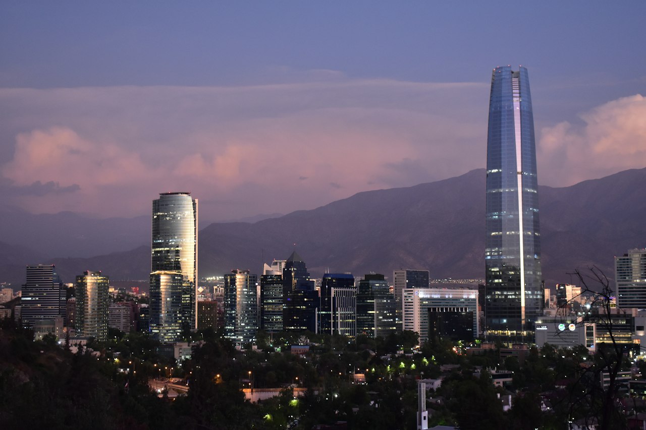 Santiago's skyline and Gran Torre Santiago before the Andes foothills at twilight