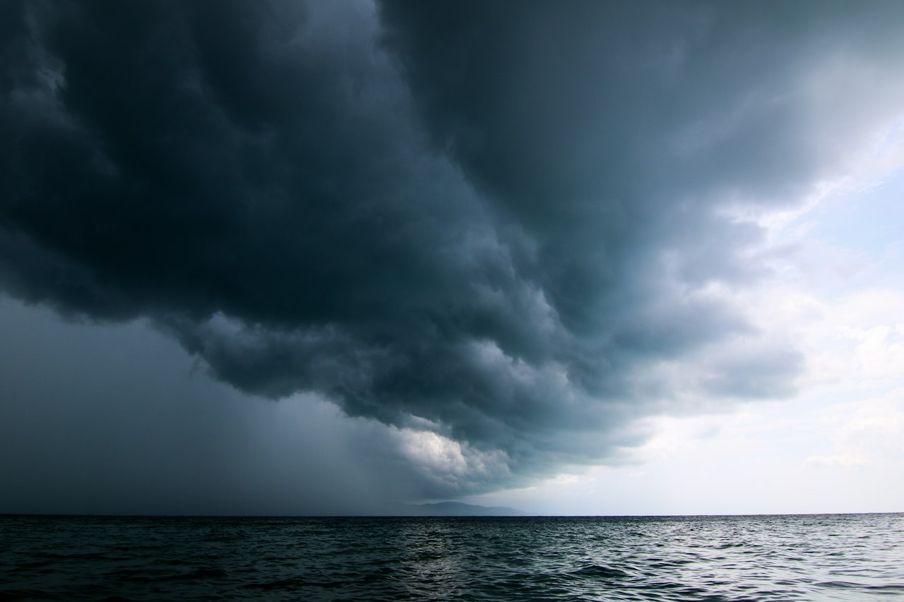 A storm moving across the sky over open water
