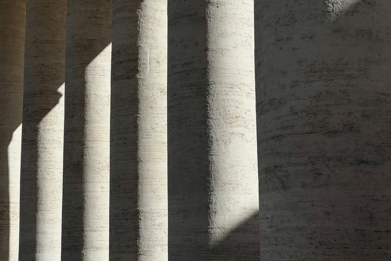 Travertine columns casting long shadows